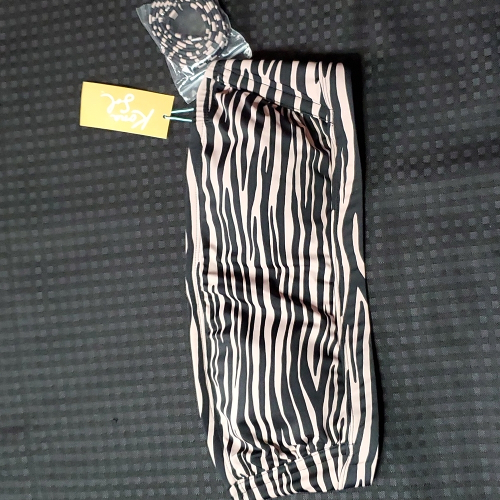 Kona Sol, black & pinkish wine, zebra striped, bikini top, size medium (8-10)